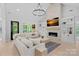 Spacious living room featuring a stone fireplace, built-in shelving, and a comfortable sectional sofa at 9564 Regent Dr, Davidson, NC 28036
