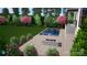 New pool set in a large backyard with beautiful landscaping and a firepit to enjoy at 9564 Regent Dr, Davidson, NC 28036