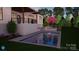 New pool with a baja step and tanning ledge, set in a sloped backyard with landscaping and firepit at 9564 Regent Dr, Davidson, NC 28036