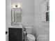 Stylish powder room with wainscoting, modern vanity, and elegant fixtures at 9564 Regent Dr, Davidson, NC 28036