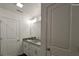 Well-lit bathroom with a granite countertop vanity, storage, and a framed mirror at Tbd Alf Hoover Rd # 4, Lincolnton, NC 28092