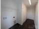 This laundry room features two doors, a wire rack for storage, and vinyl wood-look flooring at Tbd Alf Hoover Rd # 4, Lincolnton, NC 28092