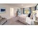 Bright main bedroom featuring neutral decor, and large windows that provide lots of natural light at 105 Rustling Waters Dr, Mooresville, NC 28117