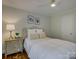 Comfortable bedroom featuring hardwood floors and neutral decor, providing a relaxing retreat at 1069 Sedgefield Rd, Charlotte, NC 28209