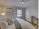 Cozy bedroom with fresh walls and hardwood floors featuring a ceiling fan at 1069 Sedgefield Rd, Charlotte, NC 28209