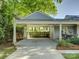 Spacious carport with room for two vehicles, connected to the house and backyard at 1069 Sedgefield Rd, Charlotte, NC 28209