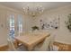 Formal dining room with chandelier and access to the outdoors at 1069 Sedgefield Rd, Charlotte, NC 28209