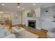 Cozy living room with fireplace, built-ins, and hardwood floors at 1069 Sedgefield Rd, Charlotte, NC 28209