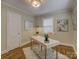 Well-lit office space featuring hardwood floors, neutral walls, and a decorative work space at 1069 Sedgefield Rd, Charlotte, NC 28209
