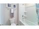 Bathroom featuring a toilet, a shower-tub combo, and modern décor and towel rack at 123 Rustling Waters Dr, Mooresville, NC 28117