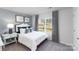 Comfortable bedroom with a cozy bed, stylish decor, and a picturesque view from the window at 123 Rustling Waters Dr, Mooresville, NC 28117