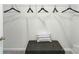 Organized closet features shelving, hanging space, and a padded bench at 123 Rustling Waters Dr, Mooresville, NC 28117