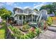 Beautiful exterior with lush landscaping and a multi-level deck at 125 Maple St, New London, NC 28127