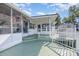 Charming exterior of the house with a wraparound deck at 125 Maple St, New London, NC 28127