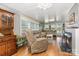 Inviting living room with wood floors, fireplace, comfortable seating, and natural light, creating a warm atmosphere at 125 Maple St, New London, NC 28127