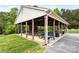 Outdoor pavilion with picnic tables, ideal for community gatherings and shaded relaxation at 125 Maple St, New London, NC 28127