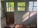 Unfinished bathroom featuring windows and plumbing at 126 N Kendall St, Norwood, NC 28128