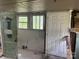Room with two windows and two doorways at 126 N Kendall St, Norwood, NC 28128