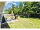 Spacious backyard with a well-maintained lawn, patio with outdoor seating, and grill at 12792 Clydesdale Dr, Midland, NC 28107