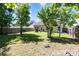 The property has a spacious, grassy backyard with mature trees, a patio, and privacy fence at 12792 Clydesdale Dr, Midland, NC 28107