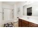 Well-lit bathroom with a tub/shower combo, wood vanity, large mirror, and tile floor at 12792 Clydesdale Dr, Midland, NC 28107