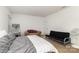 Comfortable bedroom with carpet flooring, neutral paint, futon, and birdcage at 12792 Clydesdale Dr, Midland, NC 28107