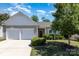 Charming home featuring a well-manicured lawn, neatly trimmed shrubs, and a convenient two-car garage at 12792 Clydesdale Dr, Midland, NC 28107