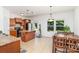 Inviting kitchen featuring a functional island, modern lighting, and a seamless transition to the dining area at 12792 Clydesdale Dr, Midland, NC 28107