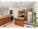 The kitchen features updated appliances, practical island, ample cabinet space, and convenient access to the backyard at 12792 Clydesdale Dr, Midland, NC 28107