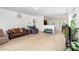 Bright living room featuring neutral walls and carpet, an open floor plan, and seamless dining area access at 12792 Clydesdale Dr, Midland, NC 28107