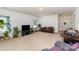 Relaxing living room with neutral walls and flooring, comfortable seating, and lots of plant life at 12792 Clydesdale Dr, Midland, NC 28107