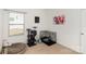 Bright room with natural light from a window featuring carpet, cat tree and a pet enclosure at 12792 Clydesdale Dr, Midland, NC 28107