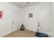 Neutral room featuring two doors, neutral carpet, and a playful, minimalist design at 12792 Clydesdale Dr, Midland, NC 28107