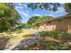 View of back of brick home and backyard with inground pool at 128 Paul Snipes Rd, Lancaster, SC 29720