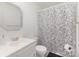 Clean white bathroom with floral shower curtain and matching accessories at 128 Paul Snipes Rd, Lancaster, SC 29720