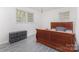 Cozy bedroom with a wooden sleigh bed and light gray vinyl flooring at 128 Paul Snipes Rd, Lancaster, SC 29720