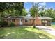 Charming single-story brick home with a well-maintained front yard and inviting covered porch at 128 Paul Snipes Rd, Lancaster, SC 29720