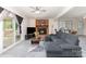 Spacious living room with brick fireplace, ceiling fan, and sliding glass doors at 128 Paul Snipes Rd, Lancaster, SC 29720