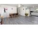 Inviting living area with grey floors adjacent to the open kitchen area at 128 Paul Snipes Rd, Lancaster, SC 29720