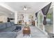 Bright living room featuring built-in bookshelves and sliding glass doors at 128 Paul Snipes Rd, Lancaster, SC 29720