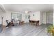 Open-concept area with lots of natural light and grey vinyl floors at 128 Paul Snipes Rd, Lancaster, SC 29720