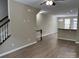 Open-concept living space with hardwood floors and natural light, designed for modern living at 13838 Winmau Ln, Huntersville, NC 28078