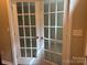 French doors lead into versatile space, ideal for a home office or study at 13838 Winmau Ln, Huntersville, NC 28078