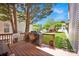 Outdoor patio with barbecue grill overlooking a well-maintained backyard, trees, and a cozy seating area at 14940 Carbert Ln, Huntersville, NC 28078