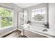 Relaxing bathroom featuring a soaking tub and separate glass-enclosed shower at 14940 Carbert Ln, Huntersville, NC 28078