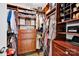Spacious walk-in closet with custom wood shelving and hanging racks for optimal storage at 14940 Carbert Ln, Huntersville, NC 28078