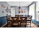 Classic dining room with a large table, wainscoting, and elegant decor at 14940 Carbert Ln, Huntersville, NC 28078
