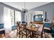 Elegant dining room adjacent to the foyer with a large table and natural light at 14940 Carbert Ln, Huntersville, NC 28078