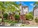Attractive two-story home featuring well-maintained landscaping and a welcoming front porch at 14940 Carbert Ln, Huntersville, NC 28078