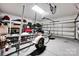 Well-organized garage with ample storage, featuring shelves and a boat trailer for easy equipment storage at 14940 Carbert Ln, Huntersville, NC 28078